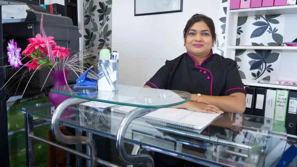 Educator at the reception desk